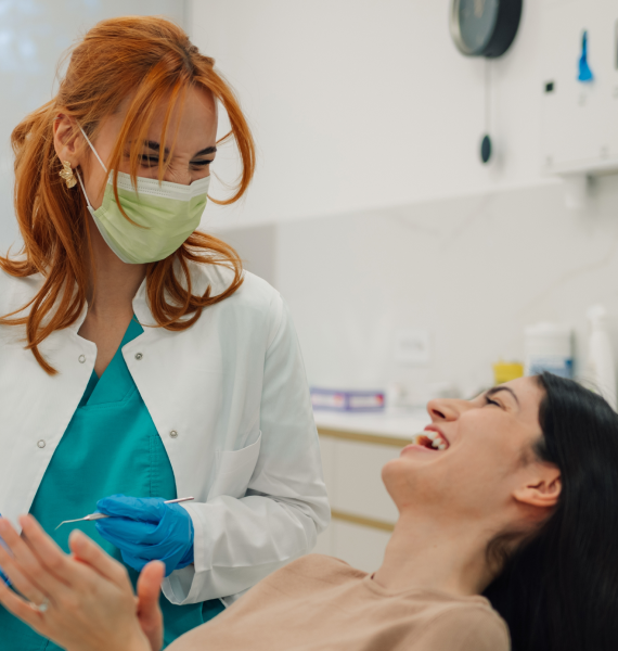 Smiling woman outside with healthy teeth